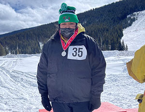 Student with a medal for snowshoeing