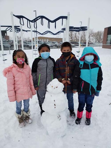 students with snowman