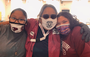 Teacher with two female students