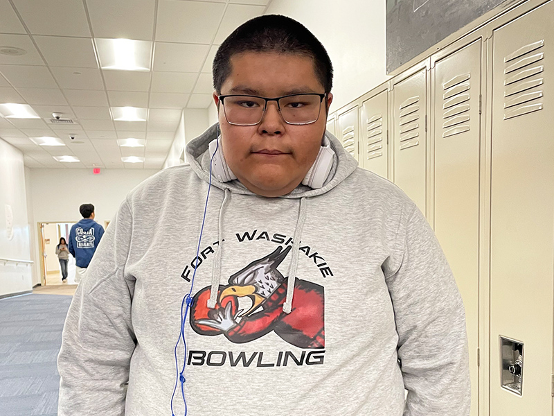 Student in the school hallway wearing a bowling sweatshirt