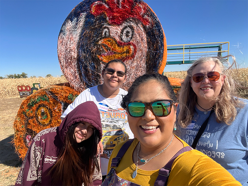 Group of happy women at a pumpkin patch